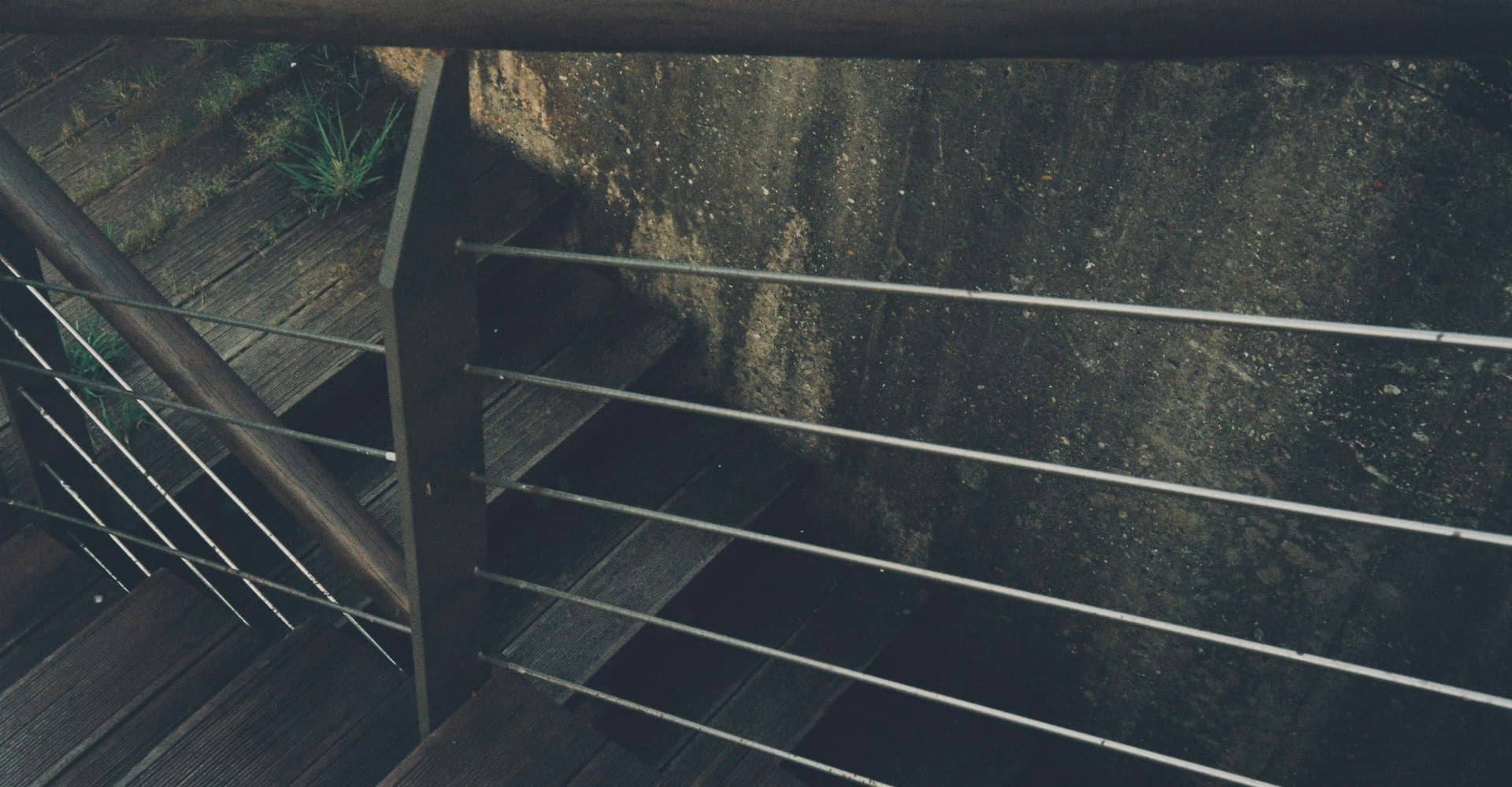 Metal railing along a pool edge
